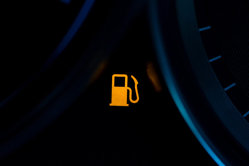 Empty Fuel Warning Light In Car Dashboard. Fuel Pump Icon. Gasoline Gauge Dash Board In Car With Digital Warning Sign Of Run Out Of Fuel Turn On. Low Level Of Fuel Show On Speedometer Dashboard.